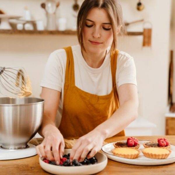 chef-woman-making-tarts-with-berries
